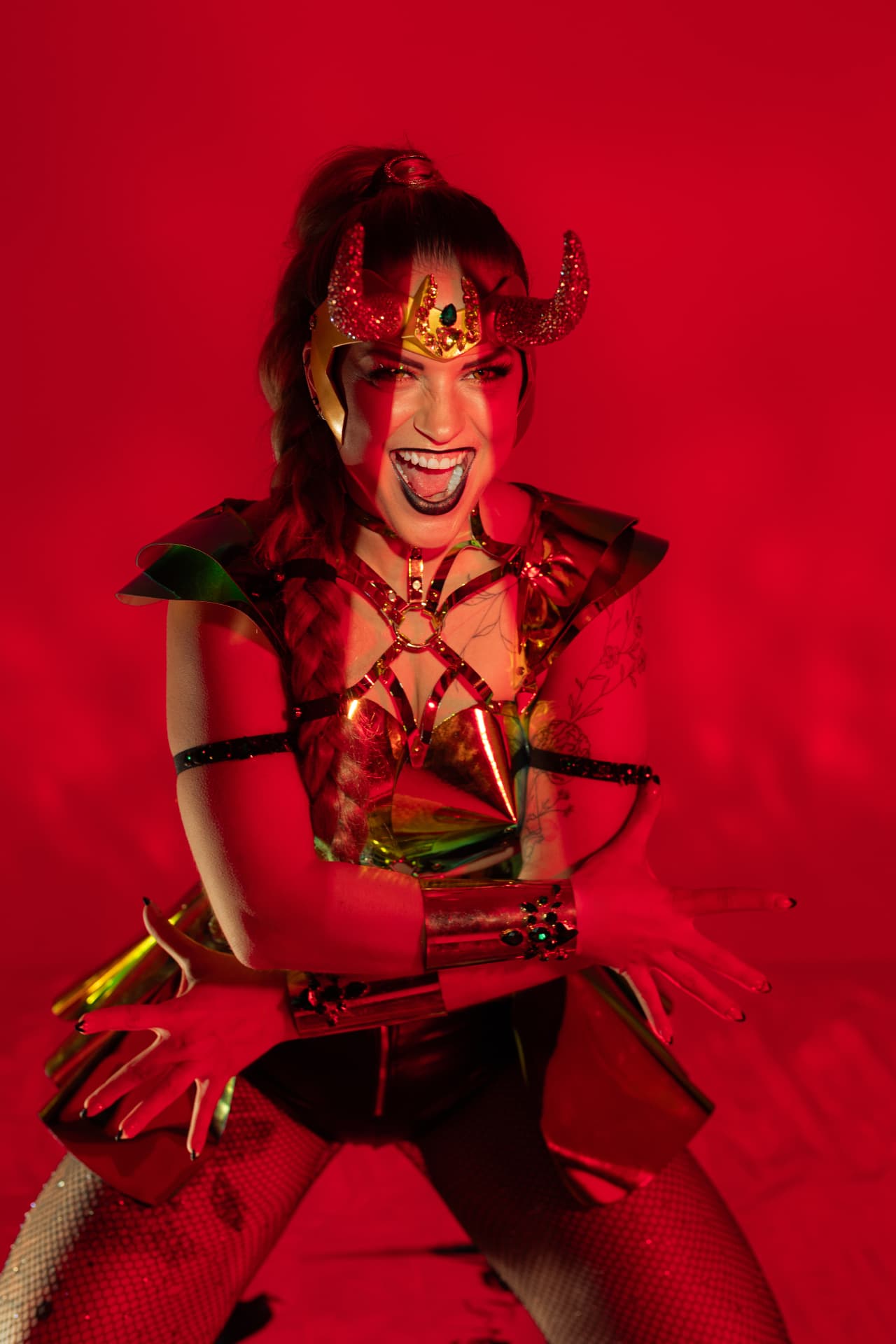 Luna de Lux in a red neo burlesque costume
